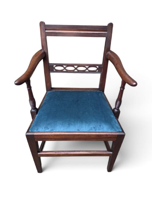 fig 1. A Victorian mahogany open armchair featuring a reeded top rail, turned arm supports, and a blue upholstered seat.