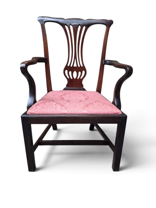 fig 1. A late 19th-century mahogany Chippendale style open armchair featuring a pierced back splat, curved armrests, and a pink patterned upholstered seat.
