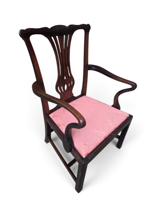 fig 2. A late 19th-century mahogany Chippendale style open armchair featuring a pierced back splat, curved armrests, and a pink patterned upholstered seat.