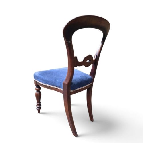 fig 2. A set of five Victorian mahogany balloon back dining chairs with carved mid-rails, turned front legs, and blue velvet upholstered seats.
