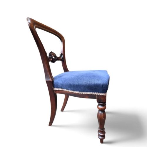 fig 3. A set of five Victorian mahogany balloon back dining chairs with carved mid-rails, turned front legs, and blue velvet upholstered seats.