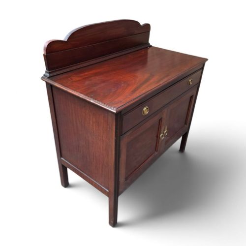 fig 2. A late Victorian mahogany chiffonier side cabinet with a shaped gallery back, a single drawer, and two panelled cupboard doors with brass handles.