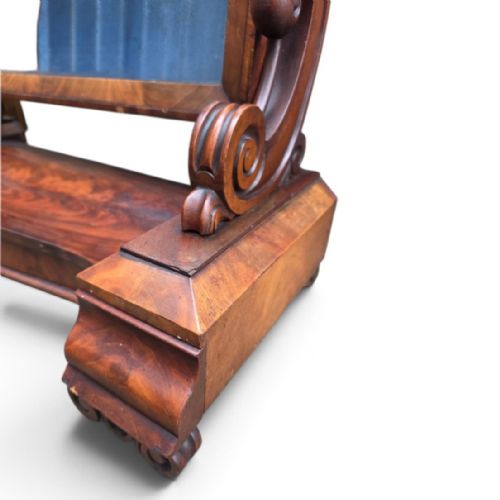 fig 2. A William IV mahogany dressing table mirror featuring an arched frame, carved scroll supports, and a shaped plinth base.