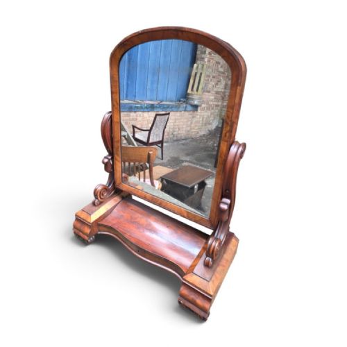 fig 3. A William IV mahogany dressing table mirror featuring an arched frame, carved scroll supports, and a shaped plinth base.