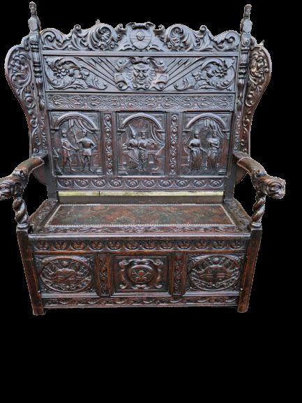 A Stunning  19thc "Jacobean" Carved Oak Box Seat Settle