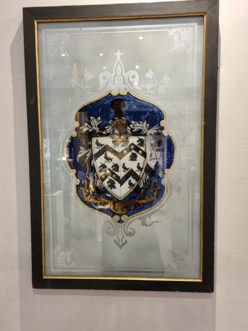 A Verre Egomise Glass  Framed Panel.bearing the Arms of St Thomas More