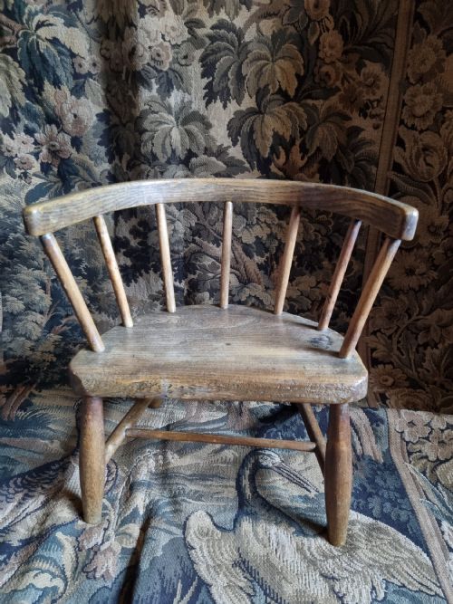 A Super Naive 19th C Ash and Elm Childs Chair .