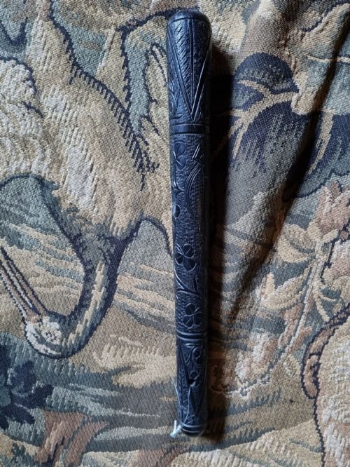 An Irish Bog Oak Carved Truncheon .