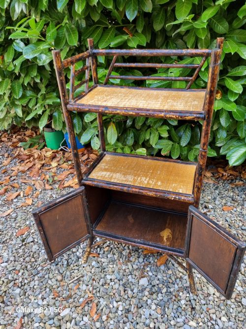 fig 1. AN ARTS AND CRAFTS BRITISH BAMBOO STAND WITH CUPBOARD