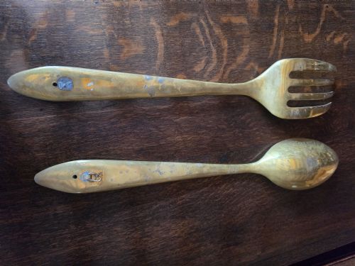 fig 1. A pair of vintage brass wall plaques shaped as a large spoon and fork with pre-drilled mounting holes at the top of the handles.