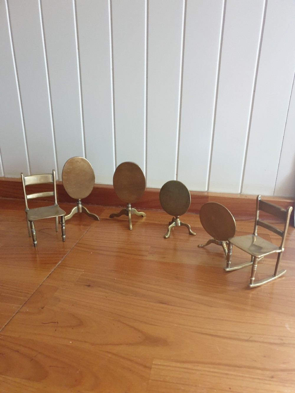 ANTIQUE MINATURE GROUP OF BRASS 
TRIPOD TABLES AND CHAIRS SIX IN TOTAL