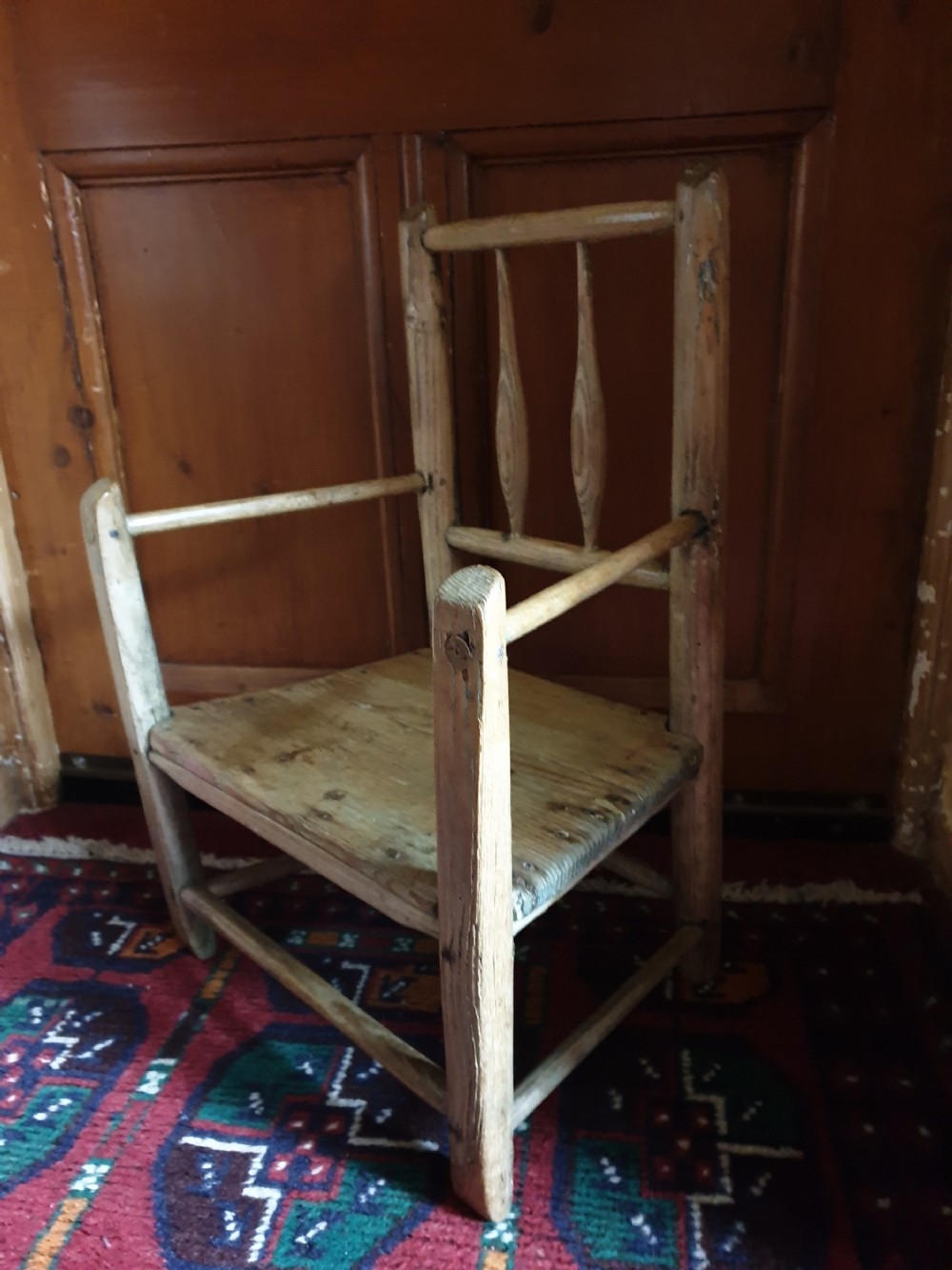ANTIQUE CHILD,S PRIMITIVE ELM ARMCHAIR 