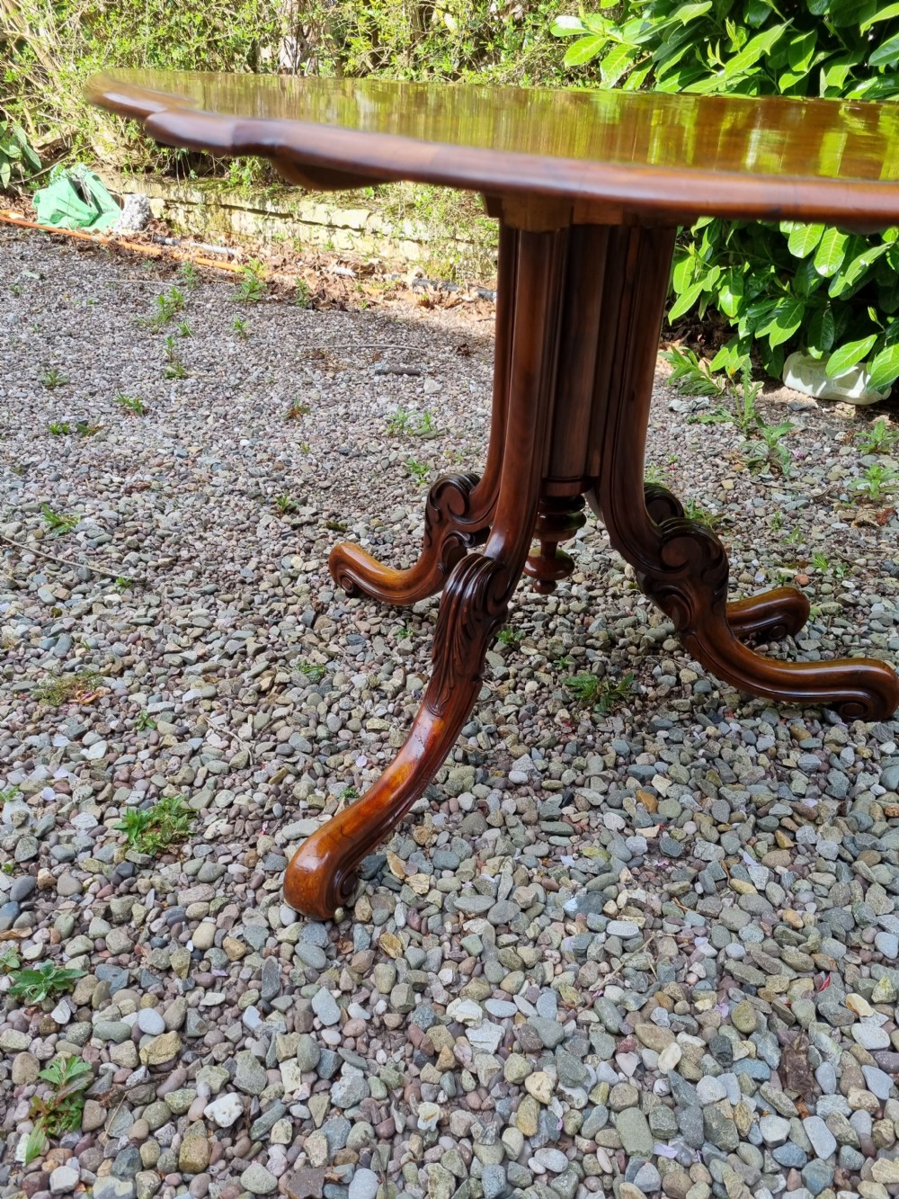 A 19th-century Victorian burr walnut drop-leaf occasional table with carved cabriole legs and scroll feet. View V