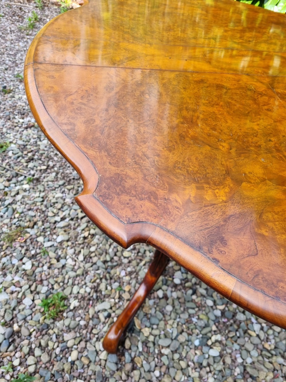A 19th-century Victorian burr walnut drop-leaf occasional table with carved cabriole legs and scroll feet. View VI