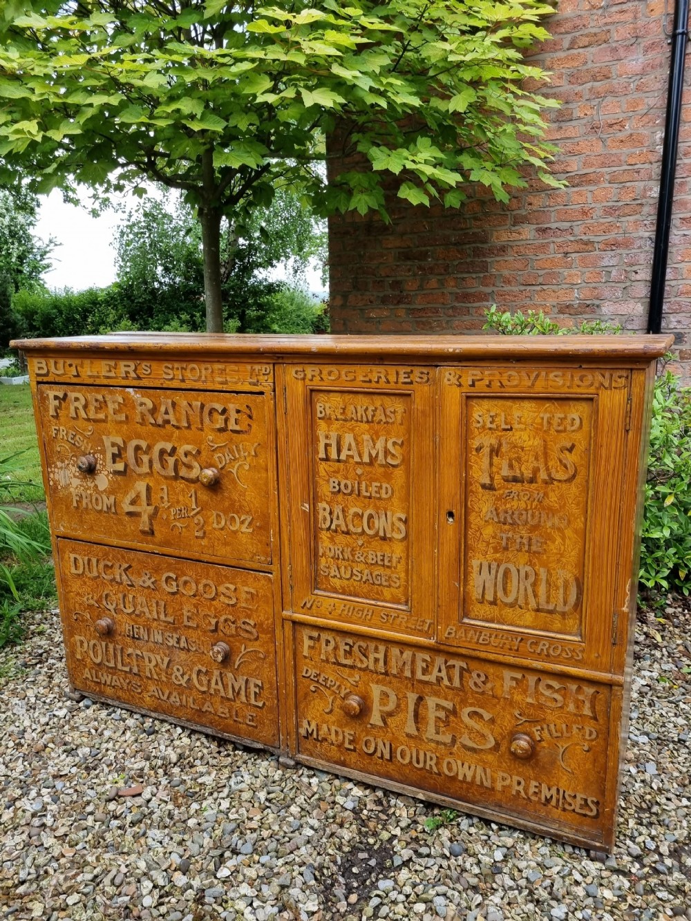 AN UNUSUAL PAINTED GENERAL GROCERS CUPBOARD 