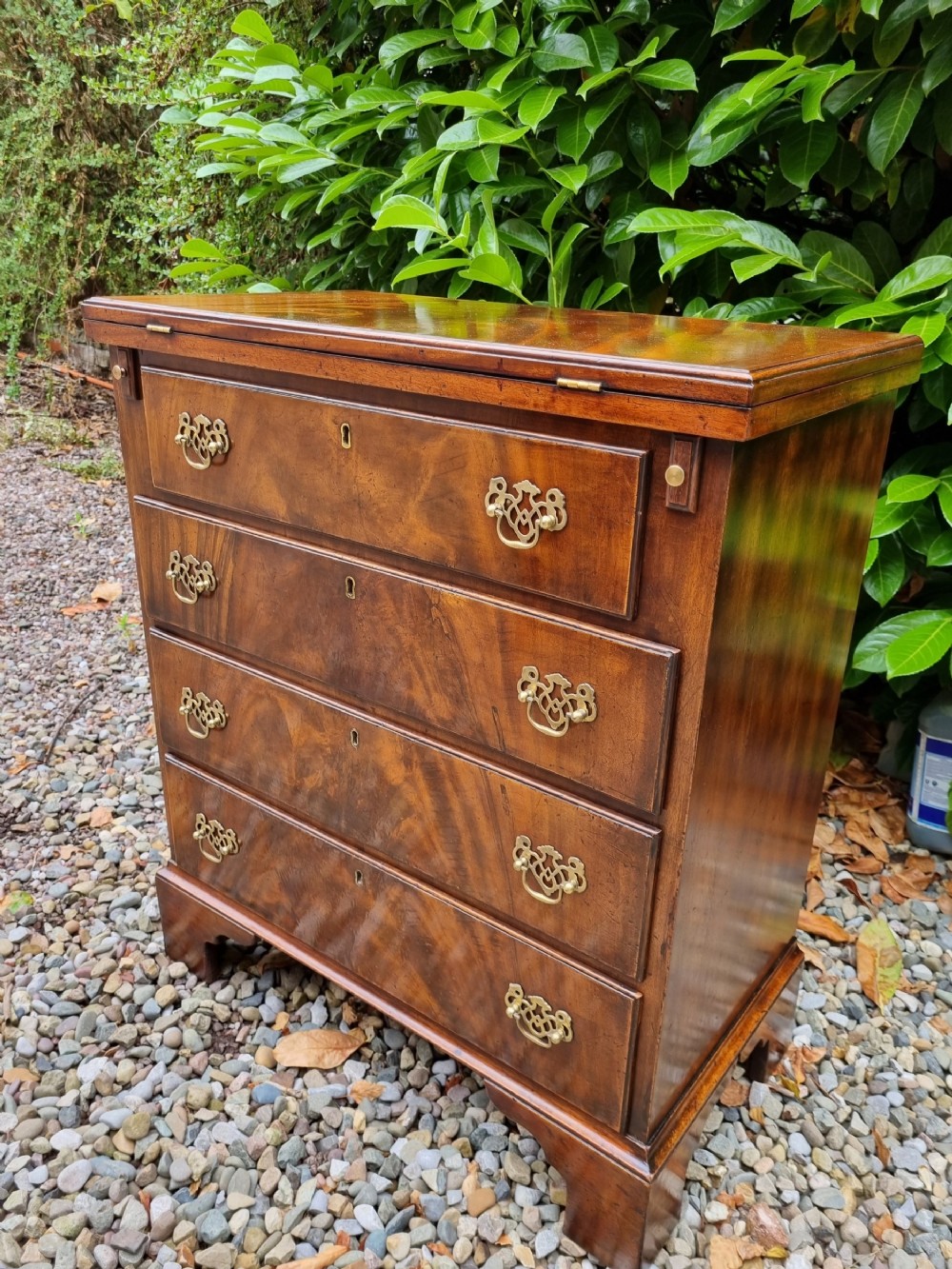 SMALL  19C FLAME MAHOGANY BATCHELORS CHEST WITH SOLID FOLDING TOP 