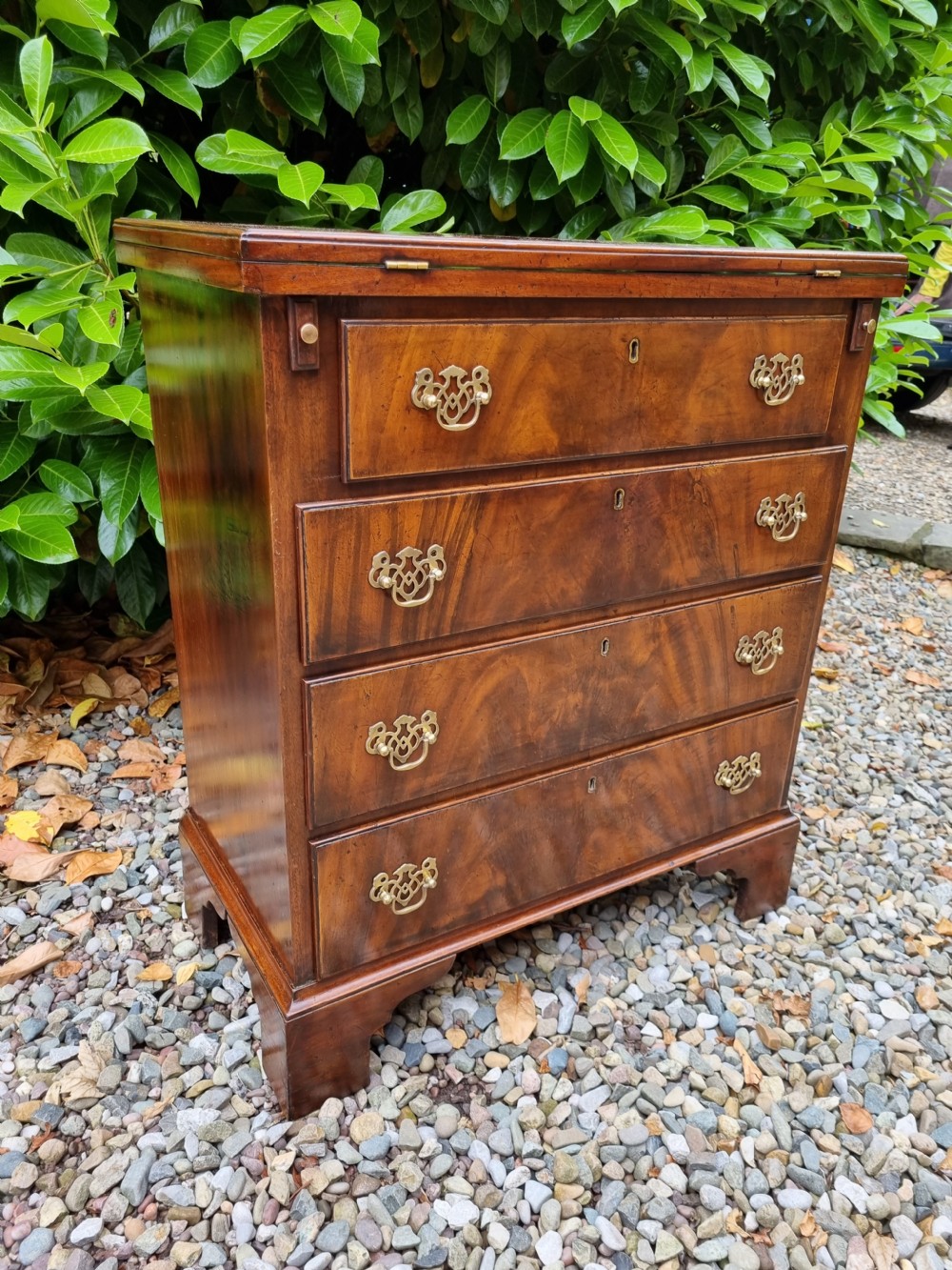 SMALL  19C FLAME MAHOGANY BATCHELORS CHEST WITH SOLID FOLDING TOP  View III