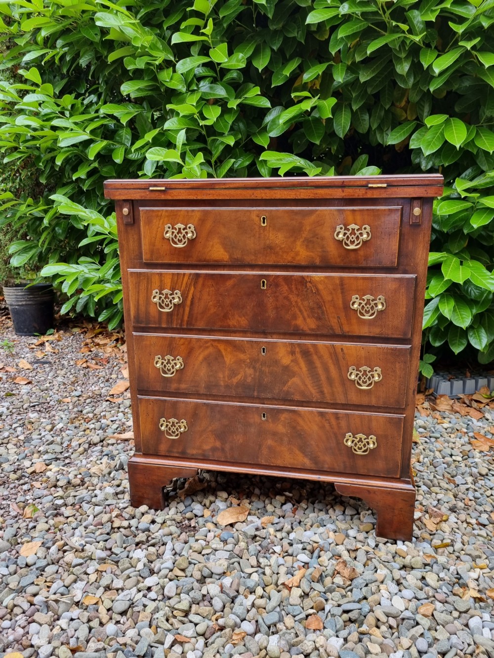 SMALL  19C FLAME MAHOGANY BATCHELORS CHEST WITH SOLID FOLDING TOP  View V