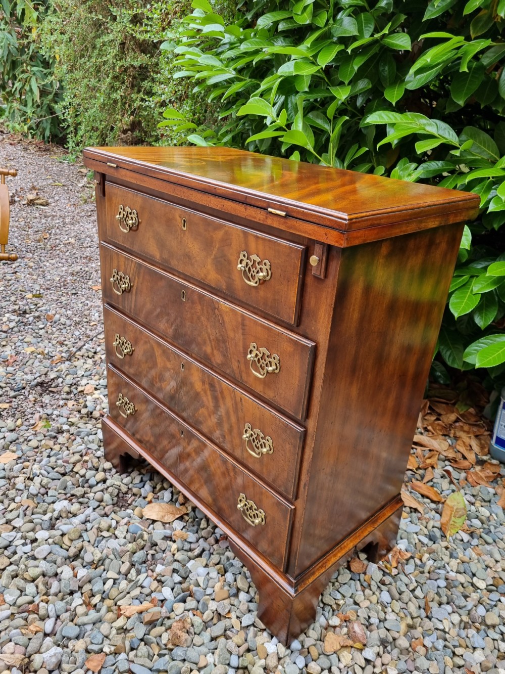SMALL  19C FLAME MAHOGANY BATCHELORS CHEST WITH SOLID FOLDING TOP  View VI