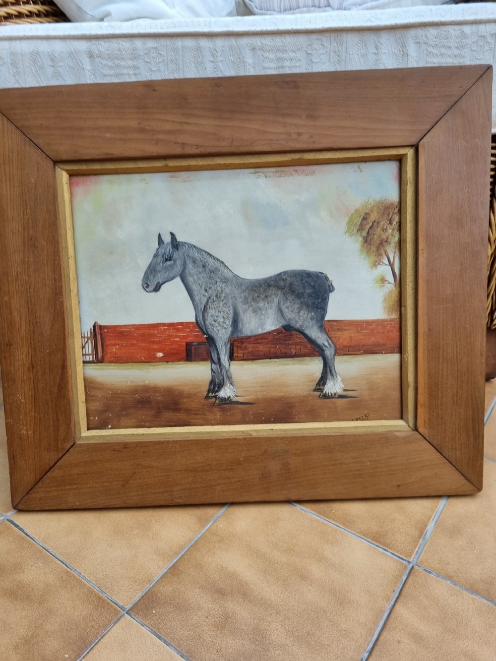 A EARLY 20THC NAIVE SIGNED OIL ON BOARD OF A PERCHERON GREY .