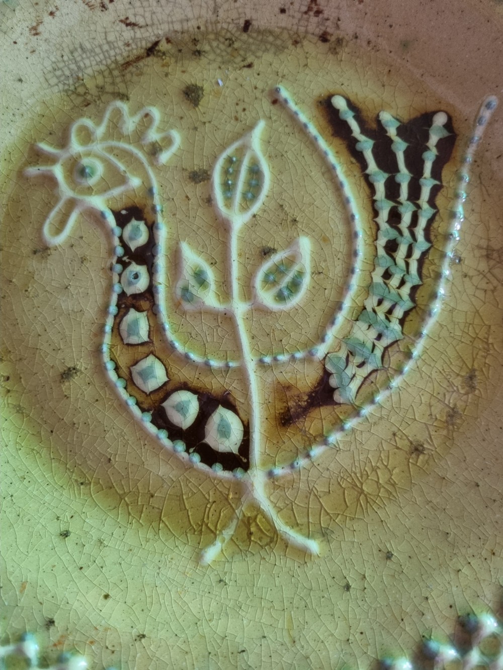 19THC OR EARLIER SLIPWARE DISH OF A STYILISED COCKERAL  View V