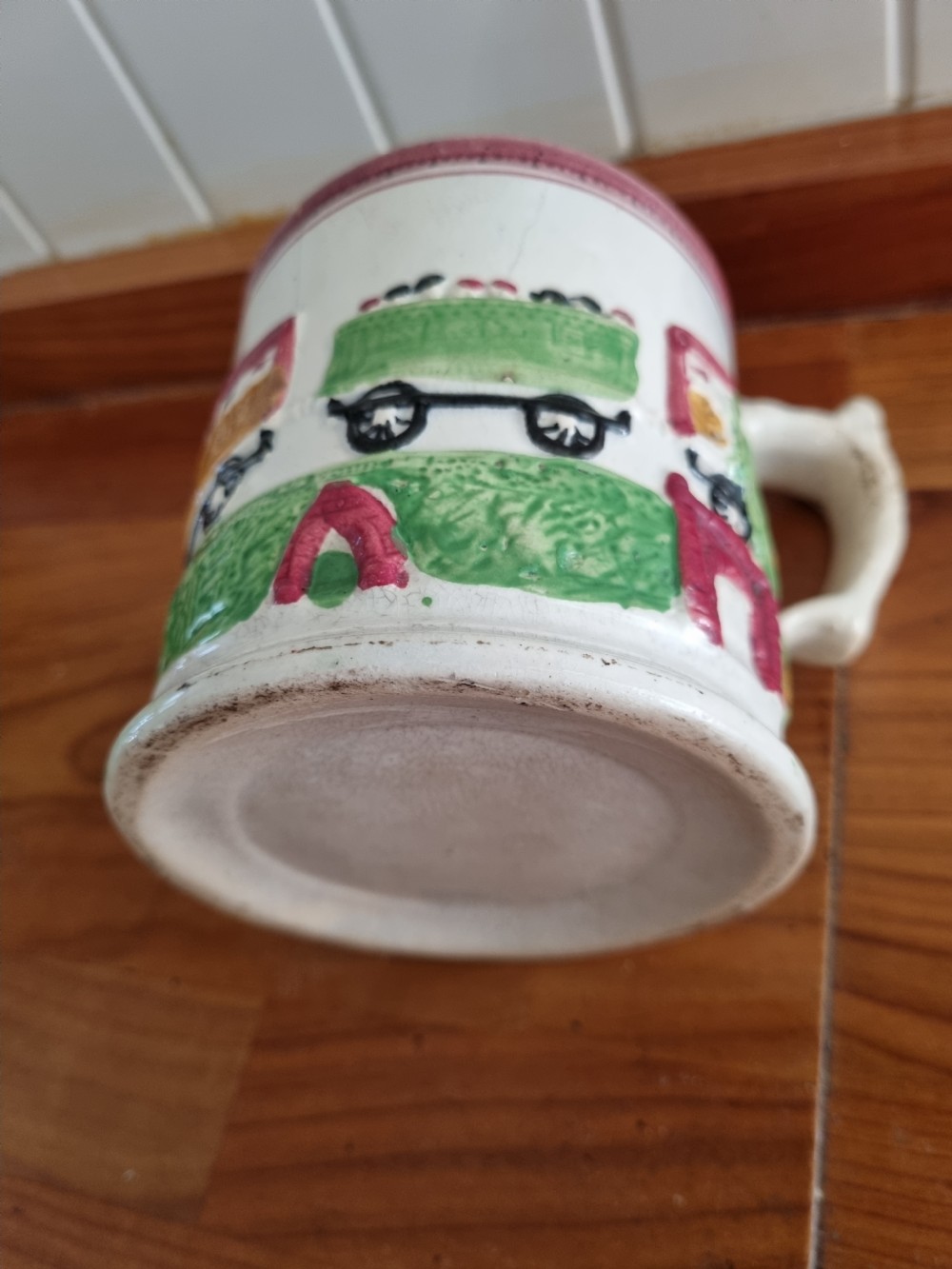 A RARE PRIMITIVE MID 19THC POTTERY MUG OF THE 