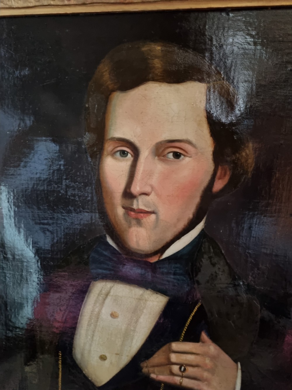 A nineteenth-century oil portrait depicting a young gentleman wearing period attire, set within an ornate gilded frame. View II