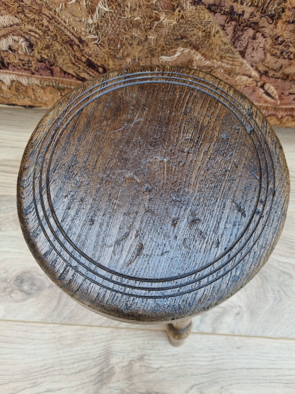 A 19THC ELM MILKING STOOL  View II