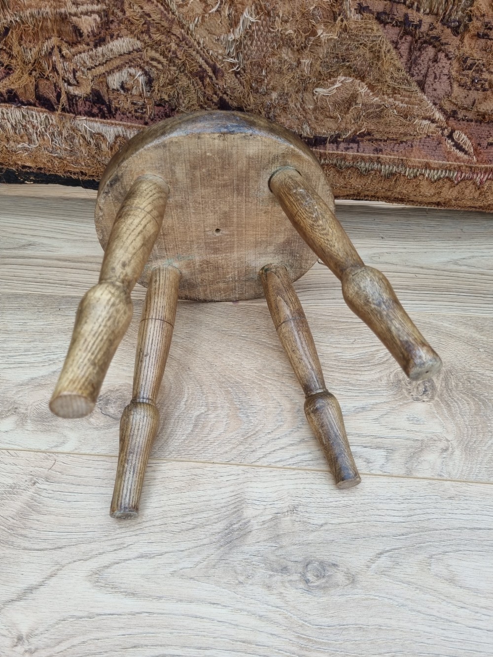 A 19THC ELM MILKING STOOL  View III