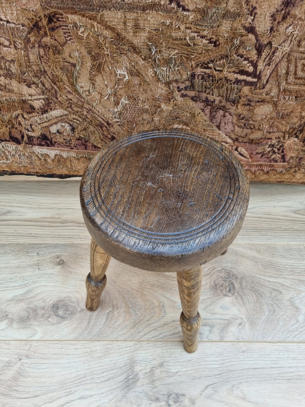 A 19THC ELM MILKING STOOL  View IV