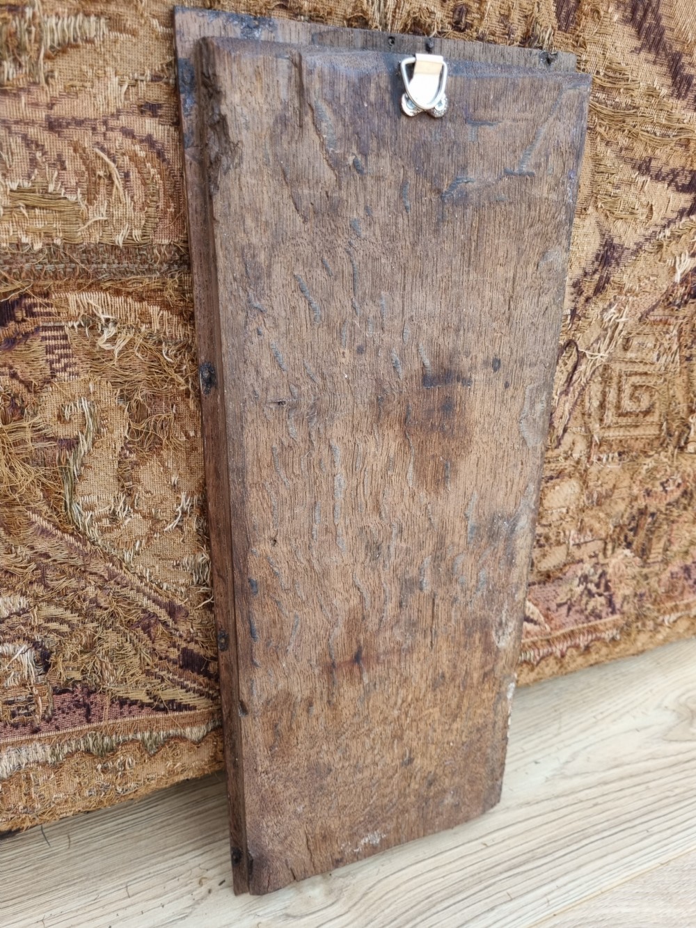 E 17THC OAK CARVED PANEL OF A LADY HOLDING A SKULL AND ORB. View III