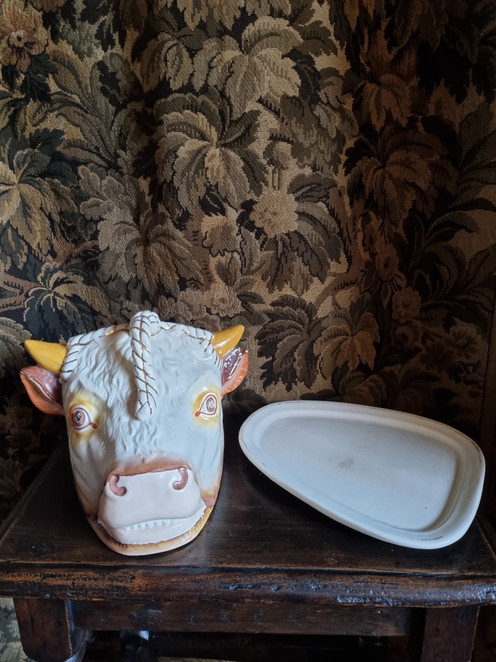 A LARGE ANTIQUE POTTERY COW,S HEAD TONGUE DISH AND COVER View V