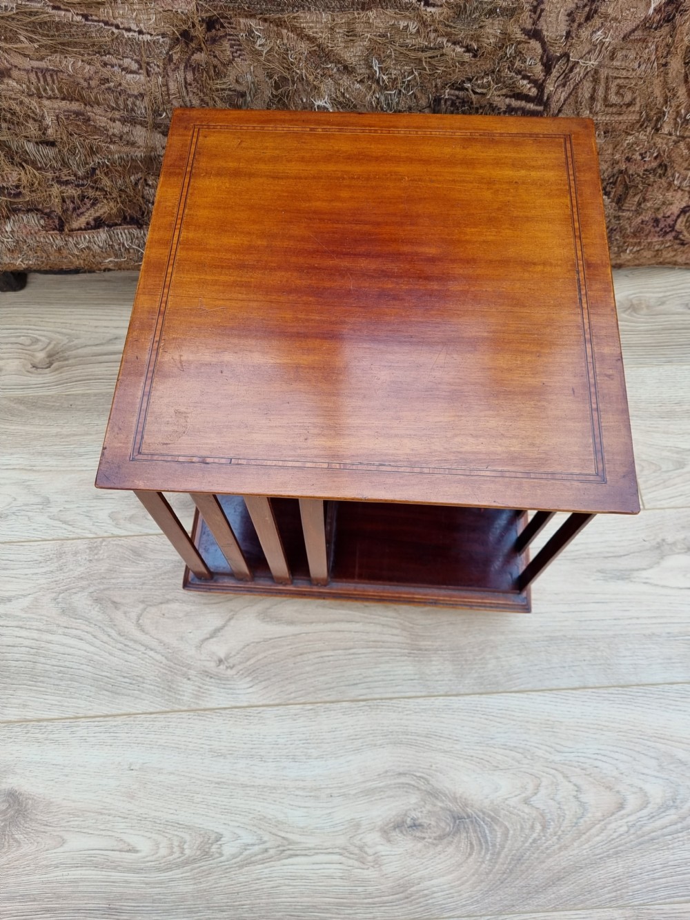 A SATINWOOD BANDED MAHOGANY TABLE REVOLVING BOOKCASE
 View II