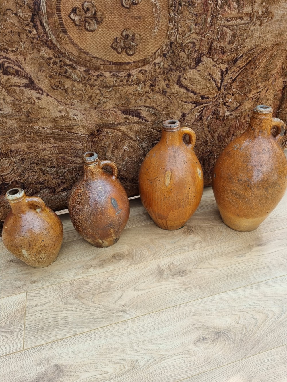 A MATCHED SET OF 4 17TH C STONEWARE  WINE JARS (BELLAMINES) View IV