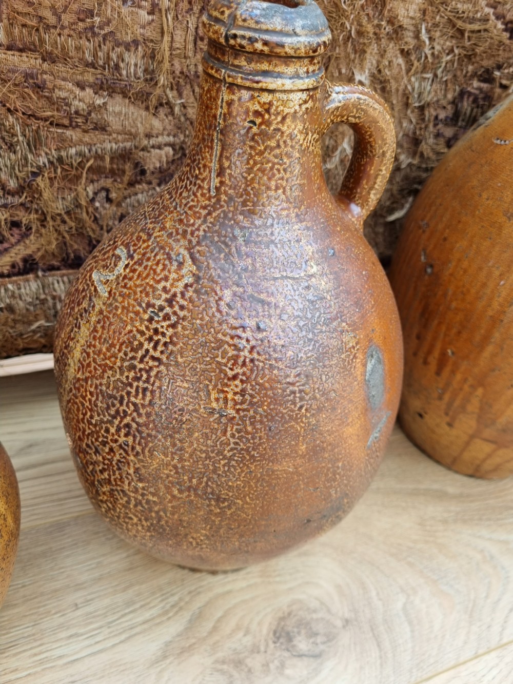 A MATCHED SET OF 4 17TH C STONEWARE  WINE JARS (BELLAMINES) View VII