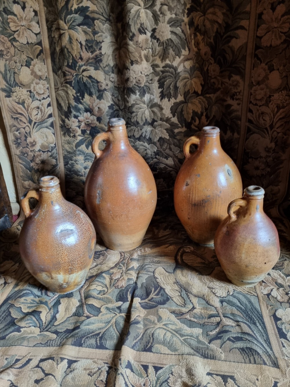 A MATCHED SET OF 4 17TH C STONEWARE  WINE JARS (BELLAMINES) View VIII