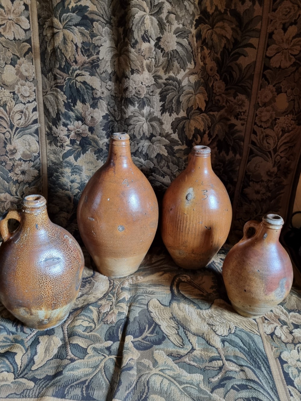 A MATCHED SET OF 4 17TH C STONEWARE  WINE JARS (BELLAMINES) View IX