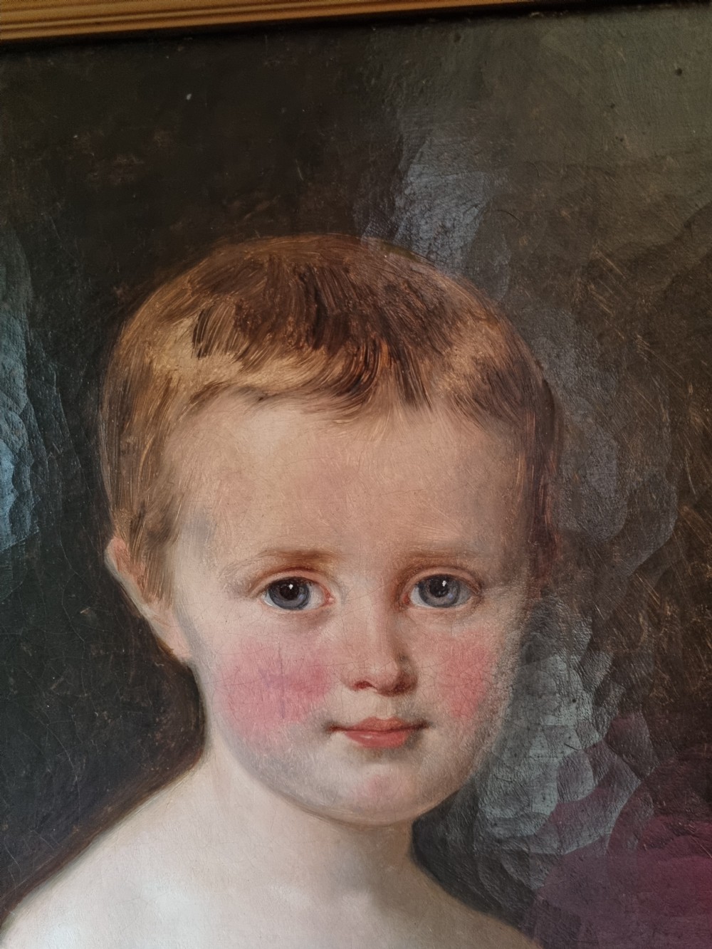 A nineteenth-century framed oil painting depicting a young girl with auburn hair wearing a pink dress with white puffed sleeves. View II