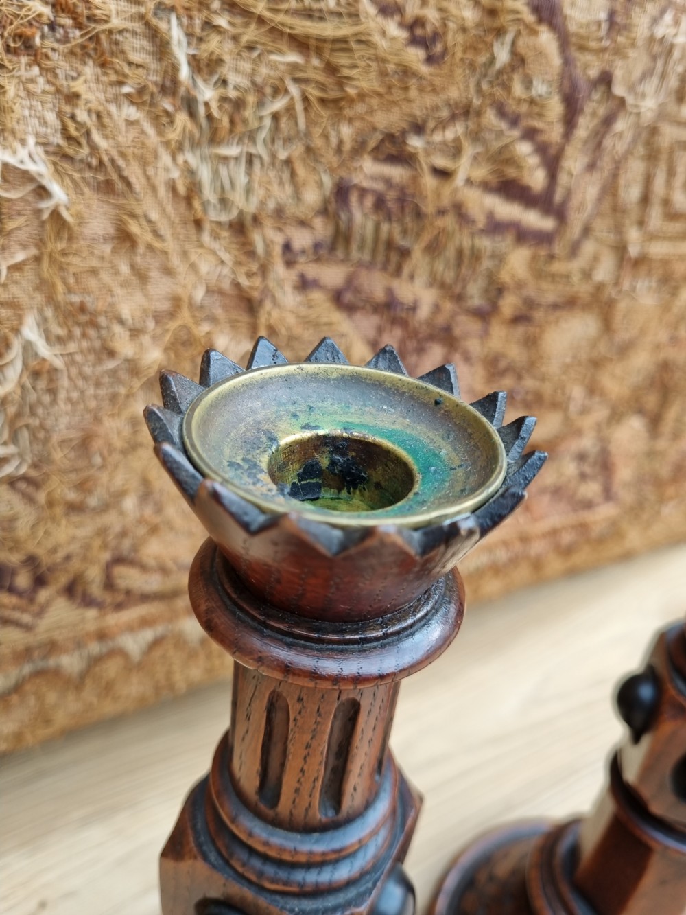 A PAIR OF OAK AND EBONIZED GOTHIC CANDLESTICKS BY A W PUGIN View II
