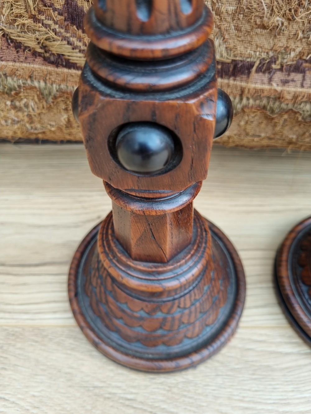 A PAIR OF OAK AND EBONIZED GOTHIC CANDLESTICKS BY A W PUGIN View III
