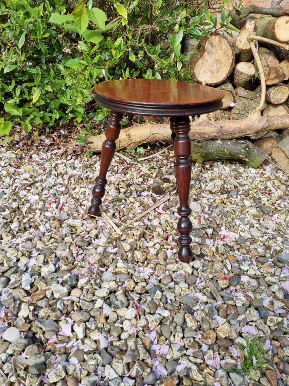 A 19THC FRUITWOOD SUPERBLY TURNED STOOL