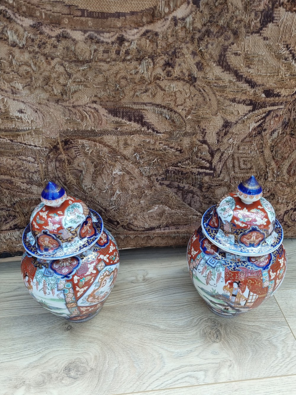 A GOOD LARGE PAIR OF 19THC IMARI VASES AND COVERS View II