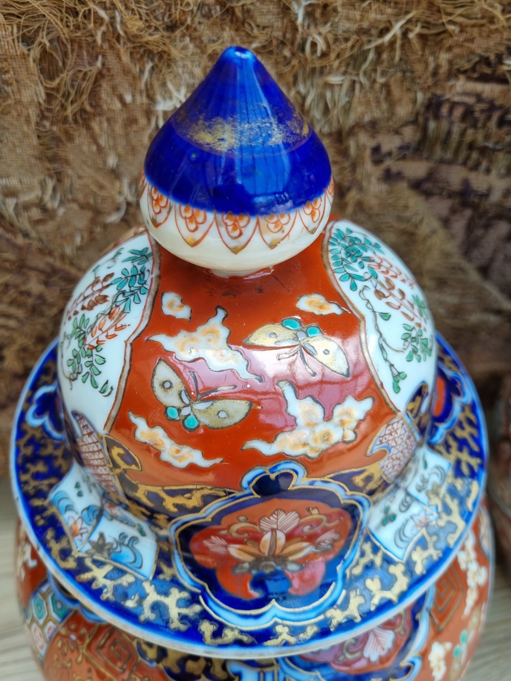 A GOOD LARGE PAIR OF 19THC IMARI VASES AND COVERS View III