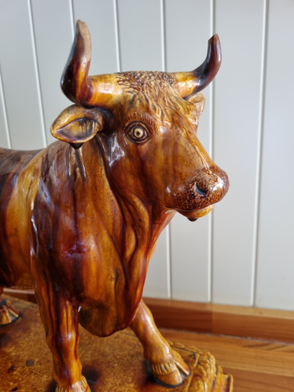 A LARGE POTTERY MODEL OF A BULL USED IN BUTCHERS SHOPS AS ADVERTISING View III