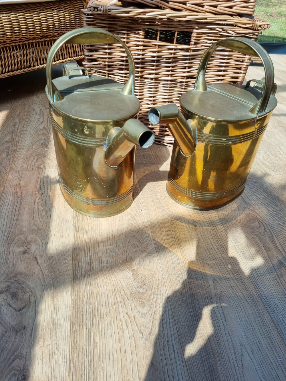 A GOOD PAIR OF LARGE ANTIQUE BRASS WATER CANS  View II