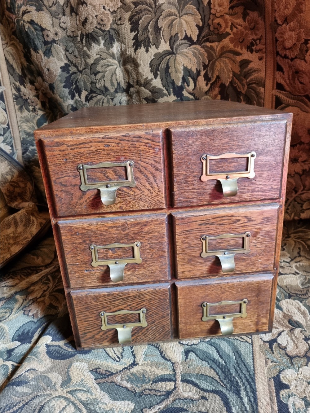 A SMALL OAK DESK TOP FILING CABINET  View IV