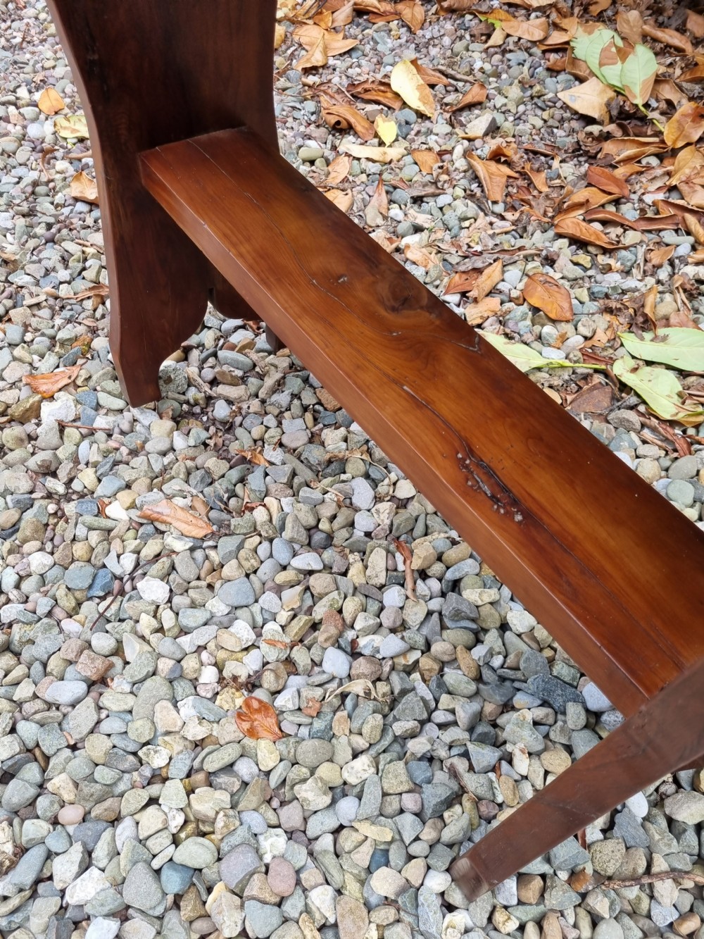 A rectangular solid yew wood stool with a lower shelf, moulded top edge, and slab-side legs. View IV