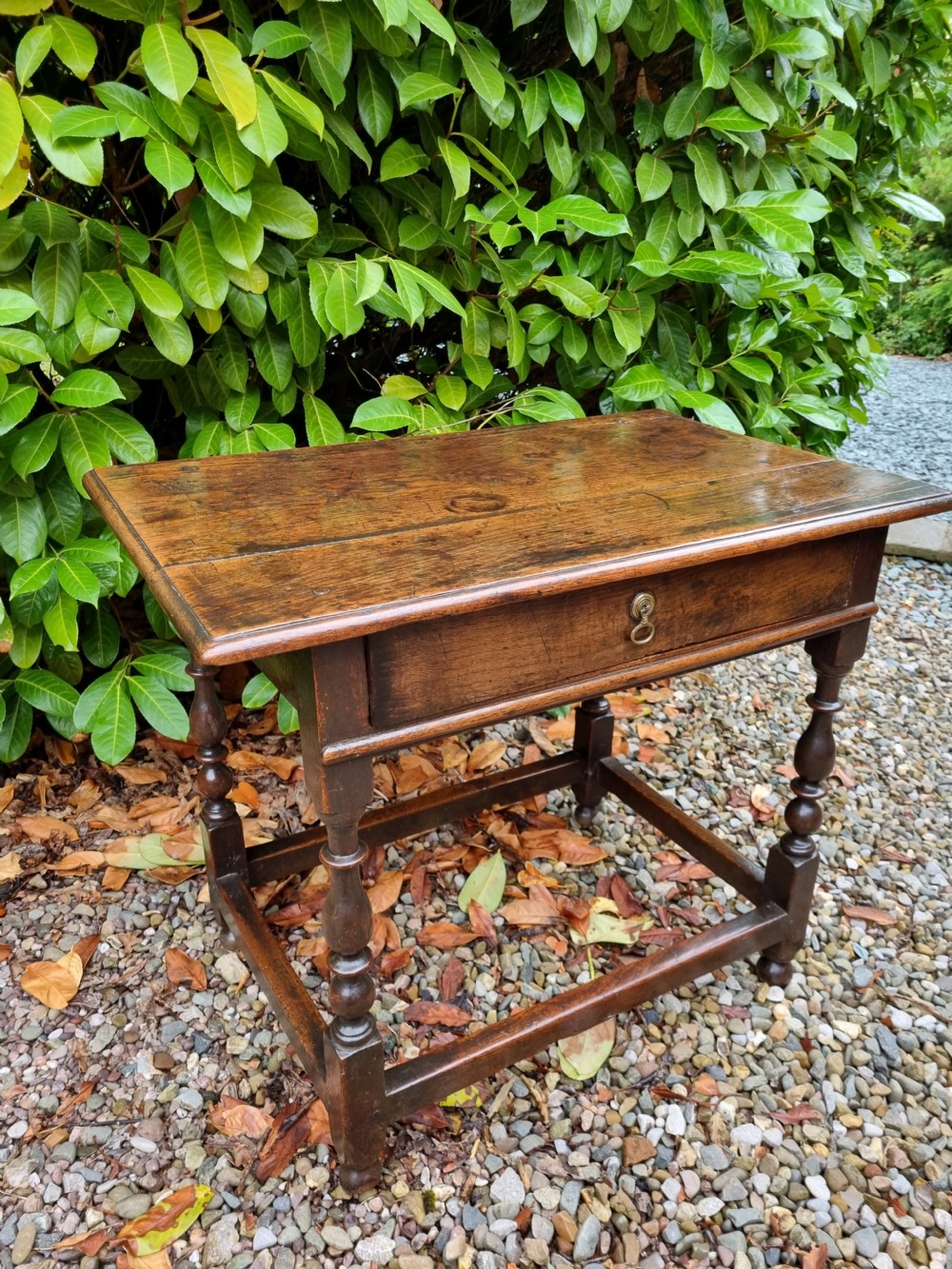 A SIMPLE HONEST EARLY 18THC OAK SIDE TABLE WITH DRAWER . View V