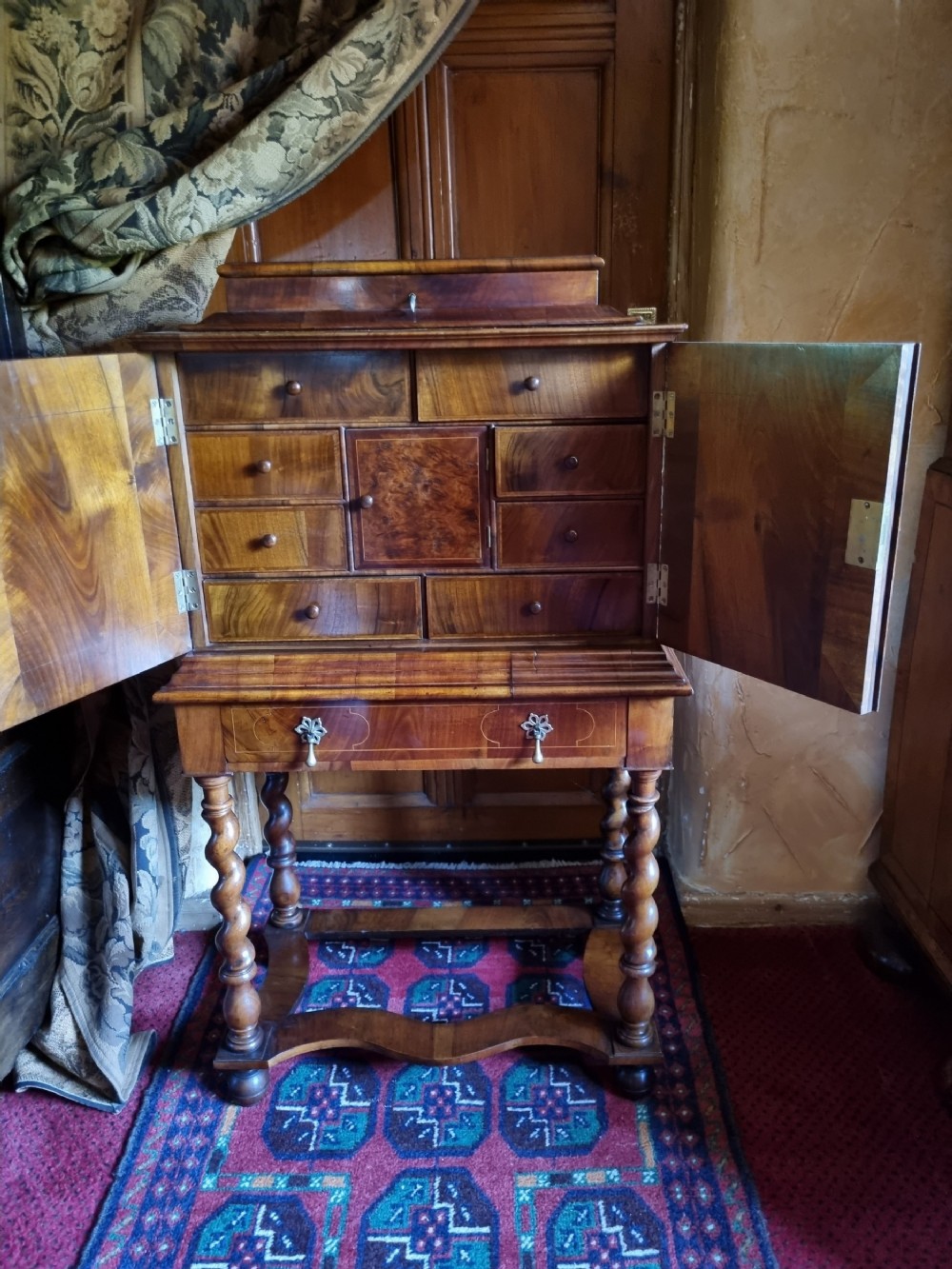 GOOD SMALL 19THC WALNUT FITTED CABINET ON BARLEY SUGAR STAND .