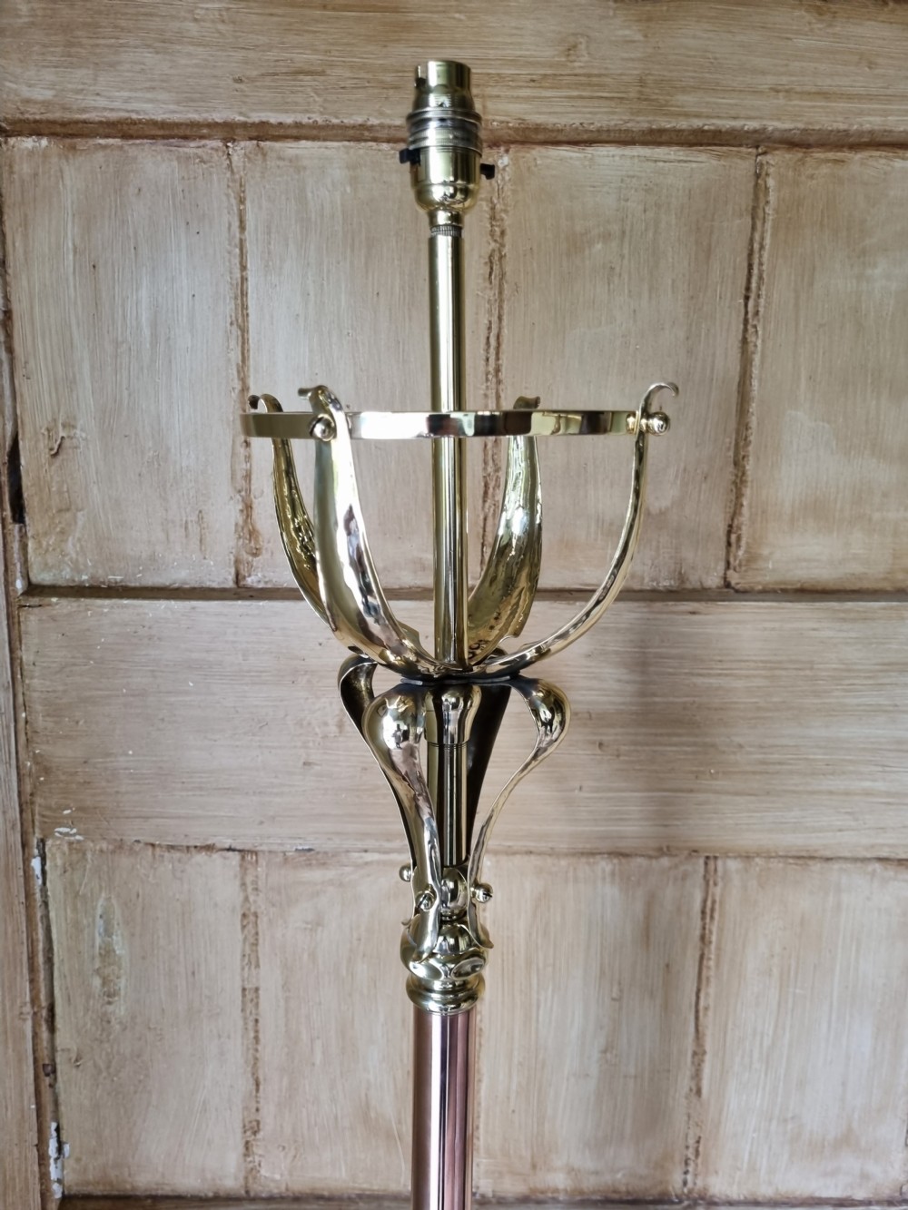 An Arts and Crafts style standard lamp crafted from copper and brass featuring a pyramidal base with decorative relief motifs and an extended central column. View VI